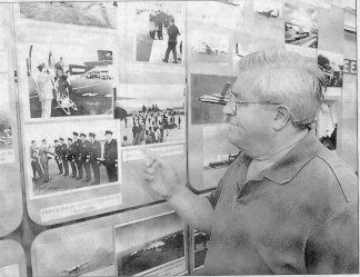 John admires the displays at the museum, including a picture of Prince Philip saying goodbye to the crew of the HP Herald after his trip to South America.